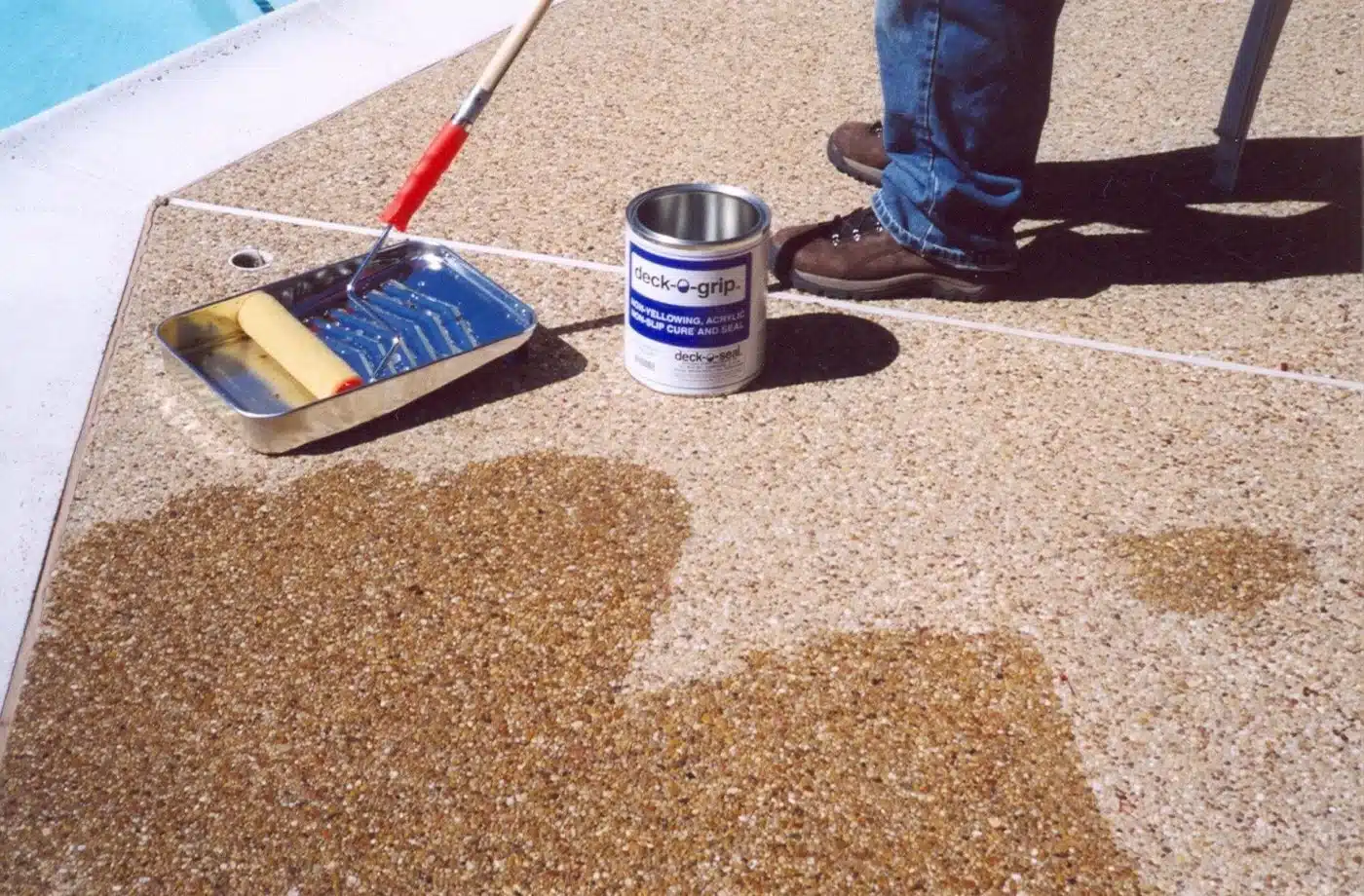Resurfacing a concrete deck requires the use of highly tenacious polymer cements and aggressive solvent-based acrylic sealers. If these heavy-duty chemicals are applied recklessly, they will permanently ruin the aesthetic details of your swimming pool. We enforce a zero-tolerance cleanliness protocol on every single job site. We know that replacing stained waterline tile or scrubbing hardened acrylic resin off a diving board is an absolute nightmare.